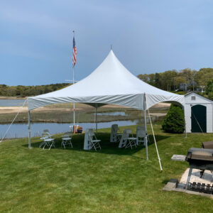 high peak tent rental setup in backyard in Dartmouth by the coast