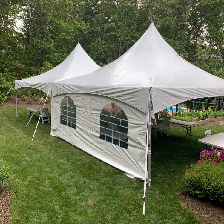 tent with sidewalls setup in a backyard in plymouth, ma