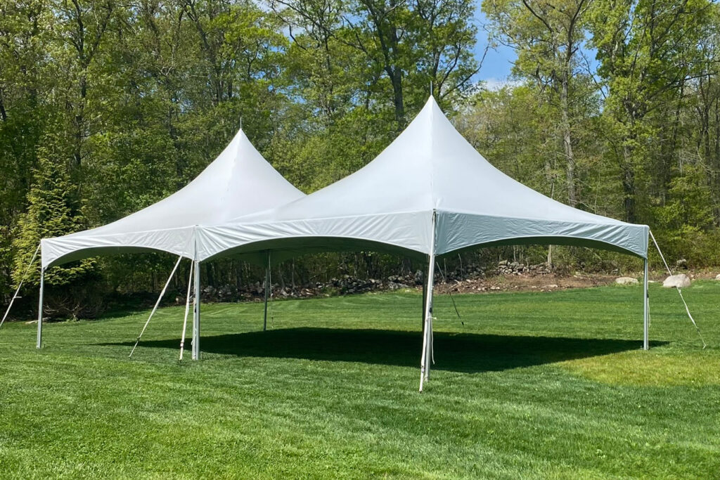 white tent rental setup in a backyard in plymouth, ma