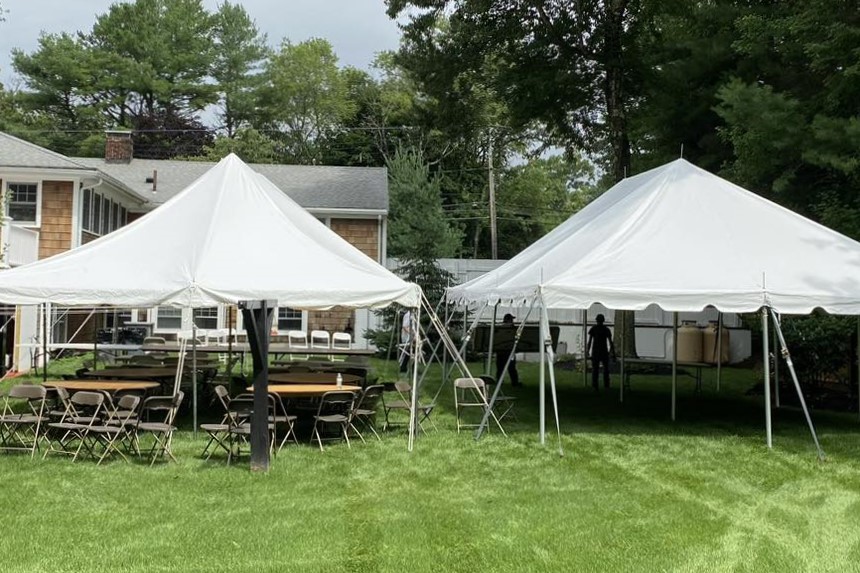 2 tent rentals setup in backyard in bourne, ma