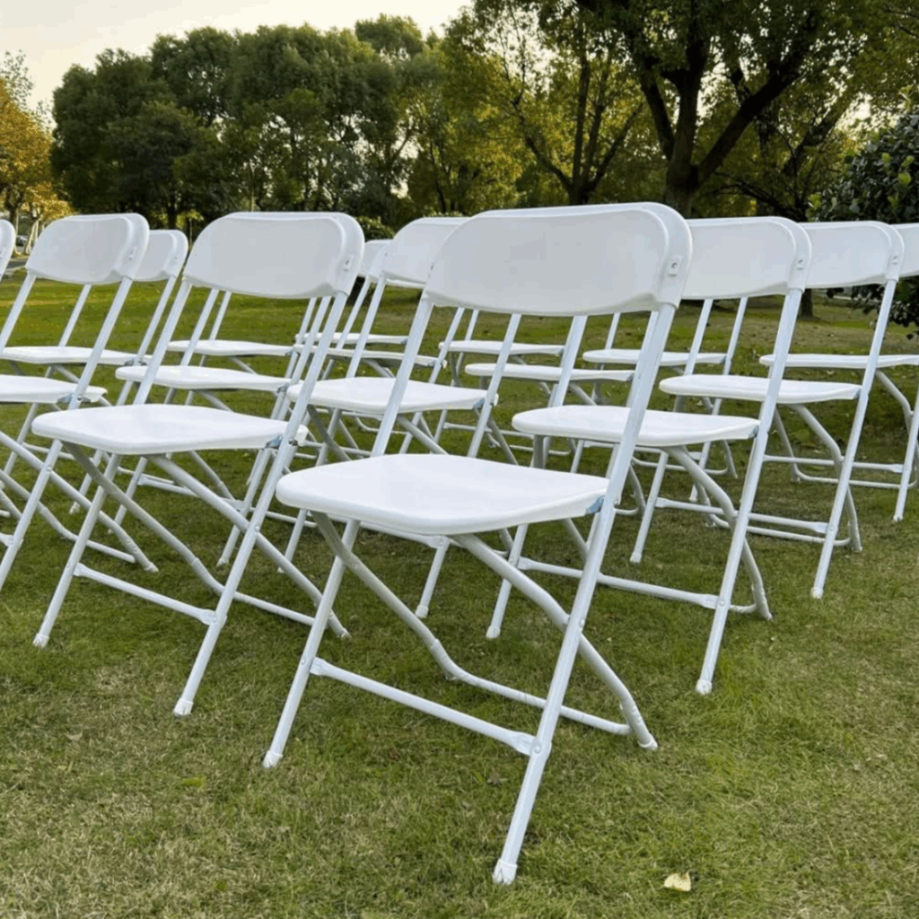 white chair rental setup on lawn in backyard in hyannis, ma